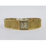 Lady's vintage 9ct gold Omega wristwatch on a 9ct gold textured bracelet strap, with Omega watch box