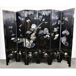 Chinoiserie six fold lacquered screen applied with coloured hardstone depicting ducks, birds,