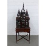 Victorian style architectural birdcage on a square top table with cross stretcher, height overall 67