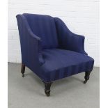 Blue upholstered wing chair of low proportions, on stained wooden legs with ceramic castors, 75 x