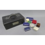 Leather jewellery box containing a selection of trinkets and costume jewellery and a quantity of