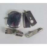 George VI silver cigar cutter, Birmingham 1949 and an Edwardian silver vesta case, Birmingham