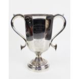 George V silver 'Fife Fox Hound' trophy cup of octagonal form on a pedestal base, the handles with