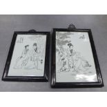 Two chinoiserie porcelain plaques, in ebonised framed with stylised hanging loops, largest overall