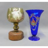 Coloured and enamelled glass to include a blue vase with a flared rim and amber glass goblet with