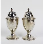 A pair of George V silver pepper pots, Chester 1911, (2)
