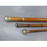 Two late 19th / early 20th century silver an white metal mounted walking canes and a Royal Scots