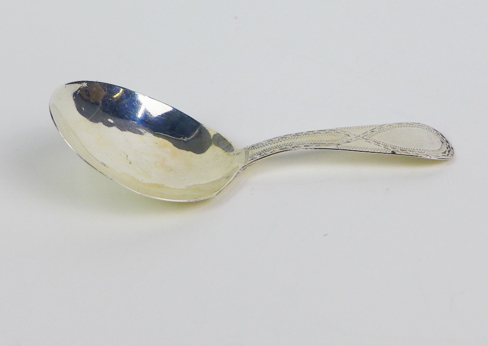 Georgian silver caddy spoon, bright cut engraved, makers mark J.W, 8cm long