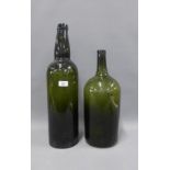 Two large green glass bottles, tallest 56cm (2)