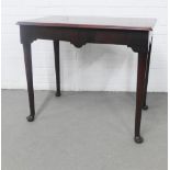 Mahogany side table, rectangular top with a moulded edge above a shaped apron, on turned tapering