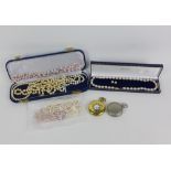 A collection of cultured and faux pearls, some with gold clasps, gold plated half hunter pocket
