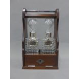 Modern Tantalus with a pair of glass spirit decanters with stoppers to include two Epns decanter