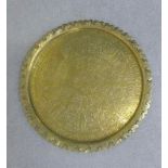 Eastern brass engraved tray of circular outline, 50cm