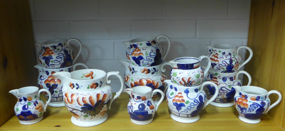 Collection of Gaudy Welsh jugs of various sizes, largest 14cm, some damages (12)