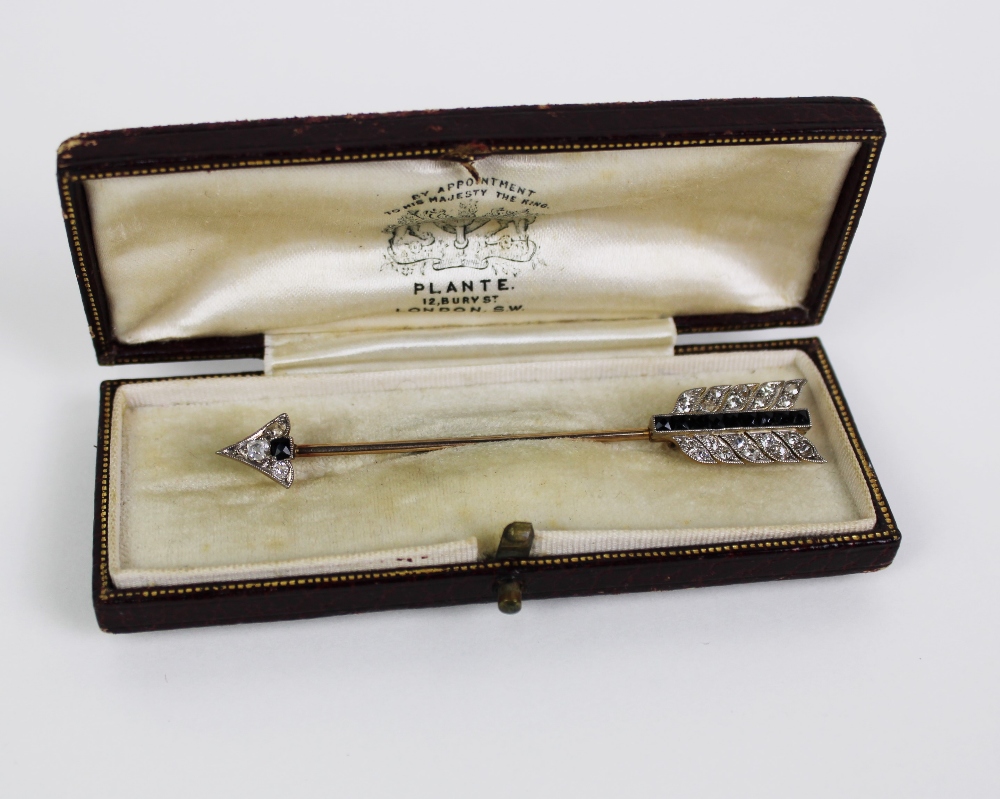 Diamond and sapphire jabot pin brooch in the form of an arrow, the quiver set with nine baguette