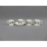Set of four Meissen floral patterned coffee cans and a one matching saucer, with brown rim lines,