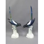 A pair of Meissen porcelain magpies, each large model sits upon a stump, blue crossed swords marks