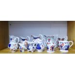 Collection of Gaudy Welsh jugs of various sizes, a similar coffee can (13) some damages
