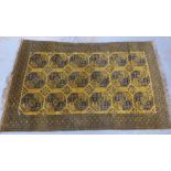 Pakistan rug of Bokhara design, the golden field with three rows of six octagons, 330 x 208cm (a/f)