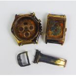 Scrap 18ct gold watch parts, fire damaged parts from a Gent's Ebel gold cased watch and a Gents's
