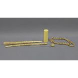 Late 19th / early 20th century carved ivory parasol handle, box and cover, hat pin and beads, etc (a