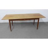 Retro teak coffee table with single drawer, on turned tapering legs, 150 x 54 x 55cm