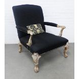 Contemporary black upholstered open armchair of large proportions, with silver giltwood arms and