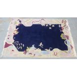 Indian wool rug, blue field and stylised floral border, 305 x 202cm