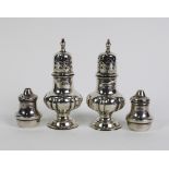 A pair of late Victorian silver pepper pots, in the form of miniature castors, Walker & Hall,