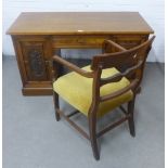 Mahogany desk with a central drawer and foliate carved doors to each pedestal, 128 x 72 x 58cm