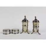 A pair of George V silver pepper pots, Birmingham 1911 and a pair silver pill boxes, Birmingham