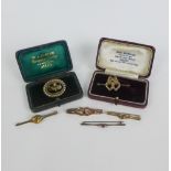 Three 9ct gold bar brooches, a white metal bar brooch set with diamonds and ruby and two seed