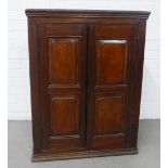 Mahogany cupboard with two panelled doors and a shelved interior, 65 x 84 x 29cm