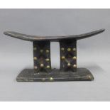 South African wooden headrest, the uprights with brass studs, 26 x 13cm