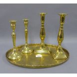 Two pairs of brass candlesticks and an oval brass tray (5)
