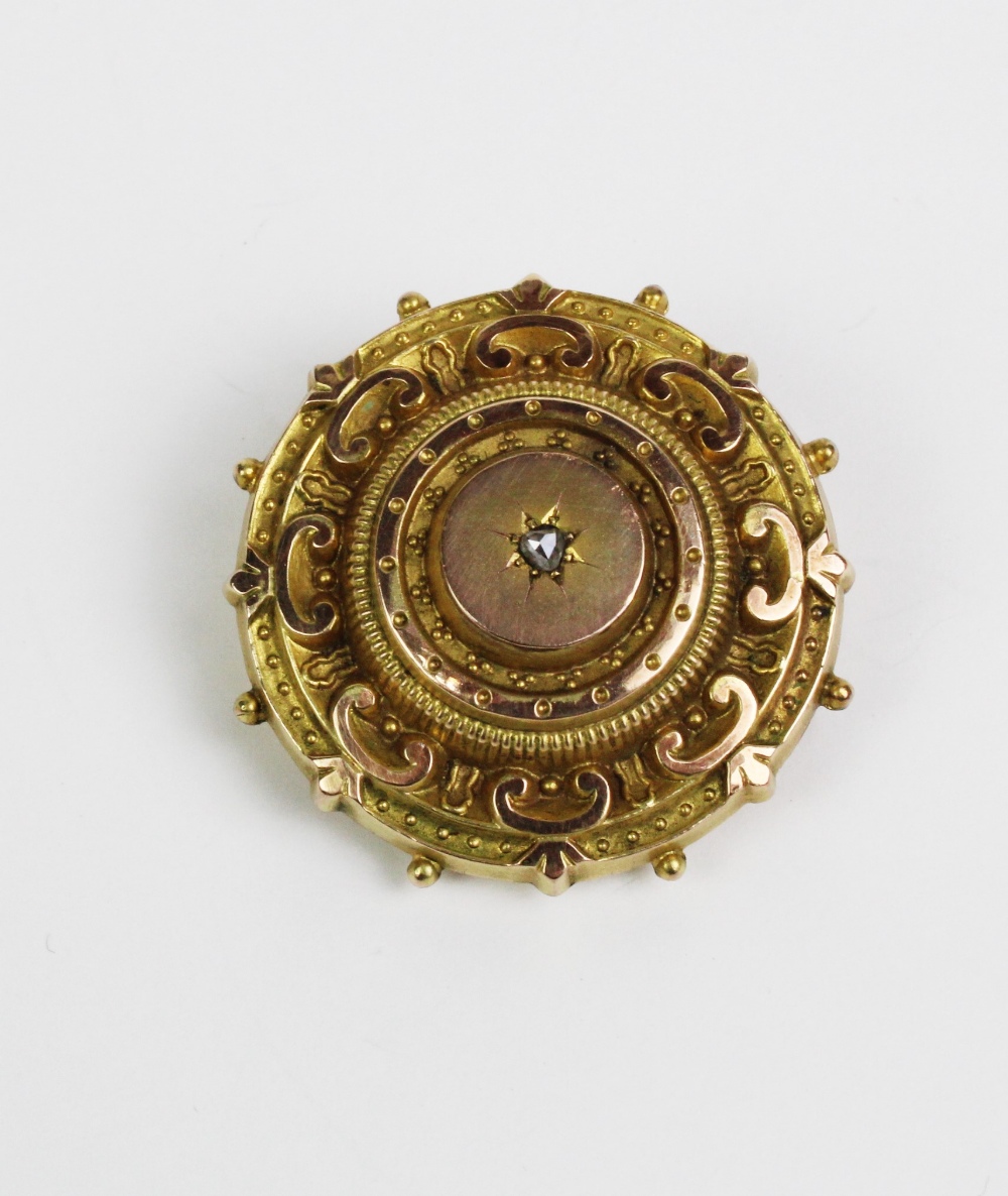 Victorian yellow metal brooch, set with a single old cut diamond and with a glazed locket panel to