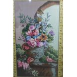 Large woolwork tapestry depicting a vase of flowers, framed under glass within an ornate gilt frame,