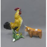 Continental pottery Cockerel, 24cm, and a Beswick highland cow, (a/f)
