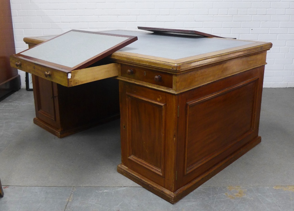 Mahogany partner's desk, the rectangular top with a pale blue leather skivver, with a drawer to each