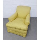 Yellow upholstered armchair on brass castors, 82 x 85 (seat depth 67cm)