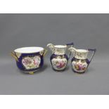 Two English porcelain jugs of graduated size painted with flowers and gilt edged rims together