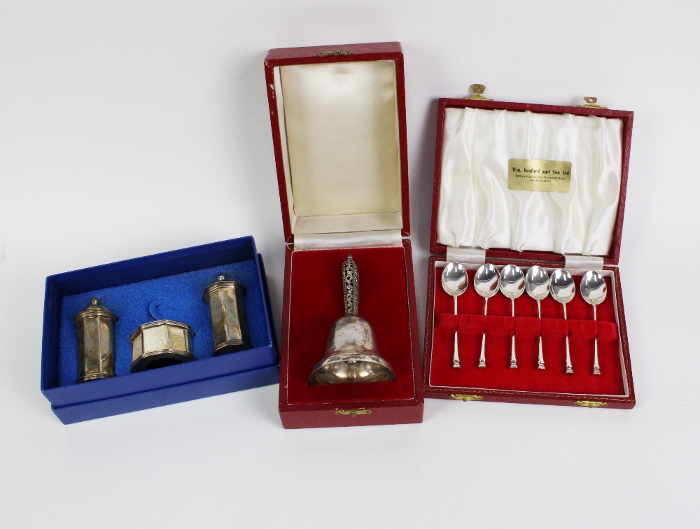 Silver bell with filigree handle, London 1987, boxed together with a three piece silver condiments