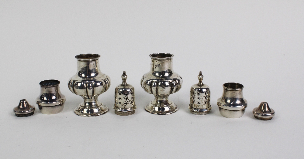 A pair of late Victorian silver pepper pots, in the form of miniature castors, Walker & Hall, - Image 3 of 3