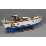 Cynette - Aberdour, a model boat with blue and white painted hull, with a motor, approx 95cm long