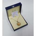 Royal Mint Half Sovereign limited edition pendant in a 9ct gold frame with pink diamonds, on a 9ct