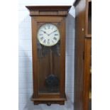 Early 20th century oak cased wall clock with glazed front. 49 x 120 x 23cm.
