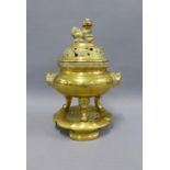 Chinese brass pot pourri jar, cover and lotus base, with character marks to the base, overall height