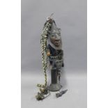 Yoruba God of Mischief Eshu staff, hung with cowrie shells and bells, approx length 50cm (a/f)