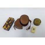 Tortoiseshell snuff box and a small ivory box in the form of a book, largest 9.5cm and a leather