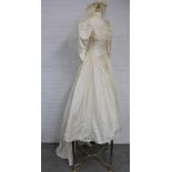1980's taffeta silk wedding dress with beaded cornice, puff bracelet length sleeves, bow to the back